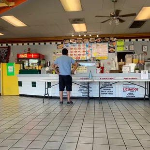 a man standing at the counter