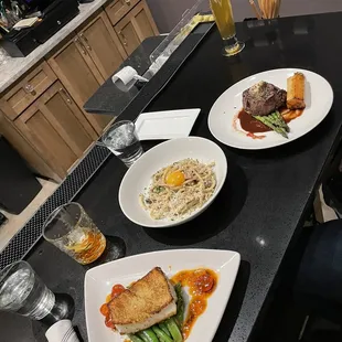 three plates of food on a table