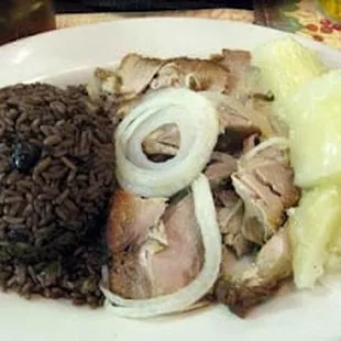 Rice and beans, roast pork, and yuca with mojo sauce
