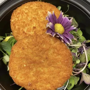 Our fried crab cakes are served with sweet chili glaze. Available on our new menu