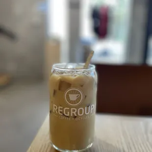 a glass of iced coffee on a table