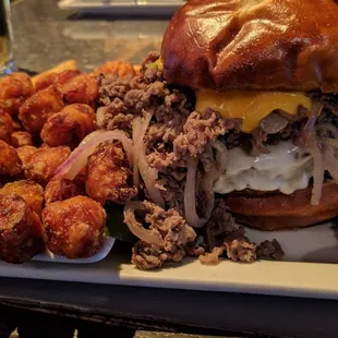 Philly cheese burger with sweet potato tater tots.