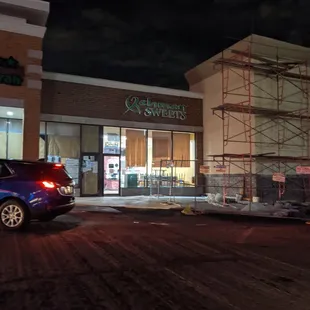 a car parked in front of a store