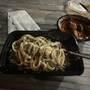 a plate of pasta and meat