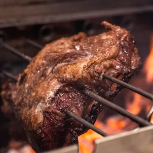 Slow Cooked Beef Ribs over Mesquite Charcoal Grill