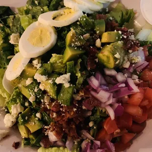 a plate of salad with hard boiled eggs