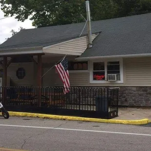 a motorcycle parked in front of a restaurant