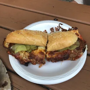a sandwich on a paper plate