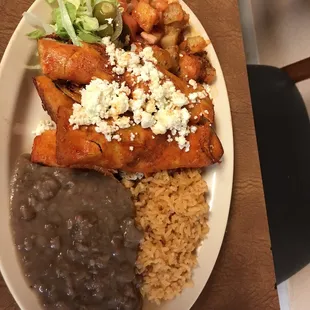 Authentic chicken enchiladas!  Fresh refried beans all for $8.99