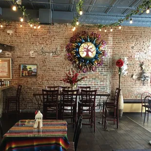 a brick wall with a clock on it