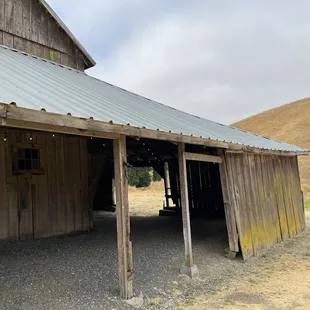 an old barn with a metal roof