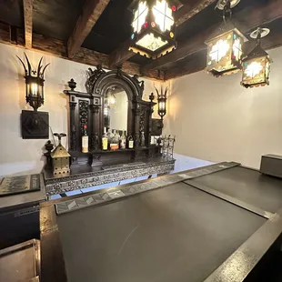 a bar with a mirror and lights