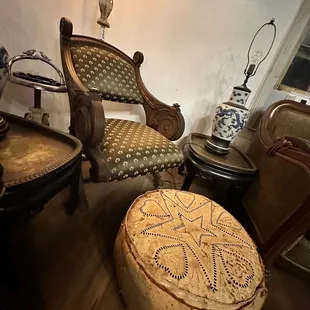 a chair and ottoman in a living room