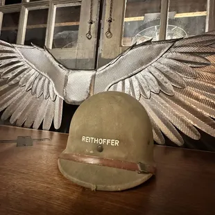 a helmet and wings on a table