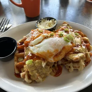 Chicken and waffles over medium on the egg