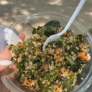 a person holding a bowl of food