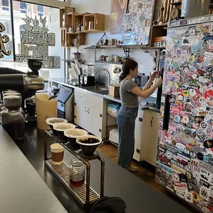 a woman working in a coffee shop