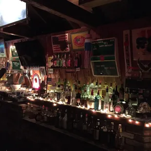 a bar with many bottles of alcohol