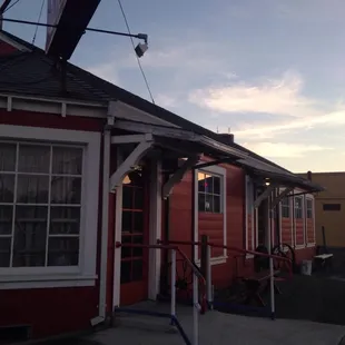 a red building with white trim