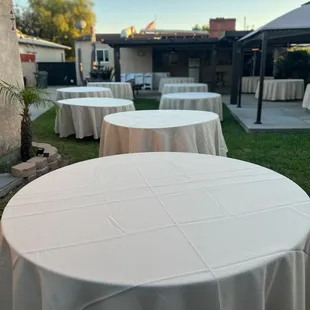 60" round tables, cream linens.