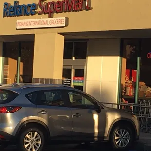a car parked in front of the store