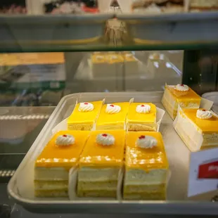 a display of cakes in a bakery