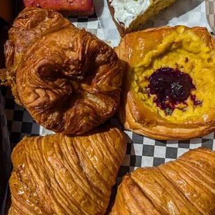 Blackberry olive oil cake, pistachio cornbread, kouign amann, creamed corn tile with blueberry miso jam, plain croissant