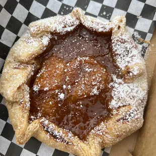 a pastry with powdered sugar on top