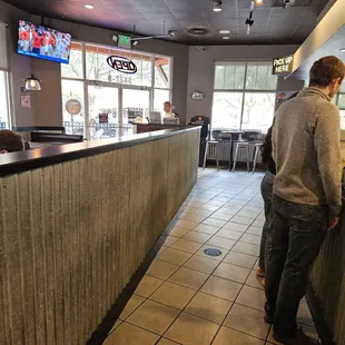 a man standing at the counter