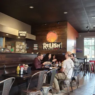 customers sitting at the bar