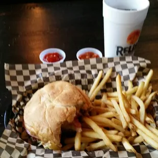 Single burger with cheese, tomato relish, guacamole, lettuce and onion.
