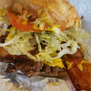 Single bacon cheese burger with the works