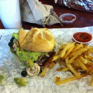 Turkey burger with guacamole and et al.