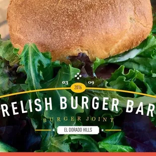 Huge burger with a fresh, crispy salad and tasty sauce