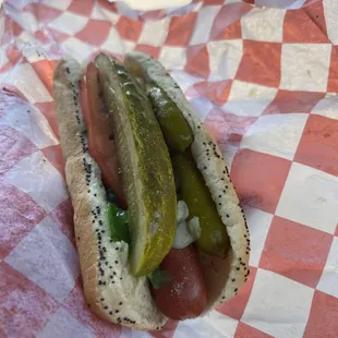 a hot dog with pickles