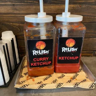 two jars of ketchup on a tray