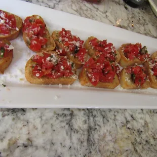 Bruschetta topped with fine grated Pecorino Romano.
