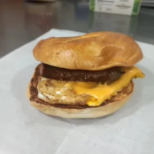 Beef sausage egg and cheese on a toasted bagel
