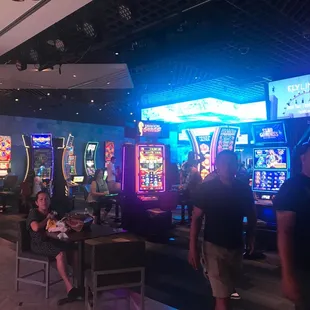 a group of people playing a game in a casino