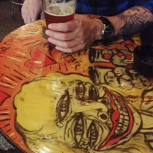 a man holding a glass of beer