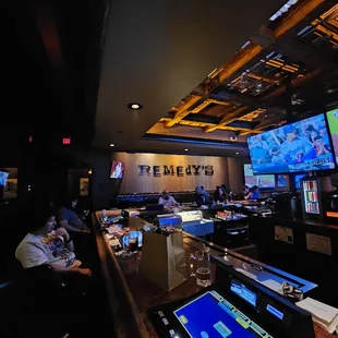 a bar with people playing video games