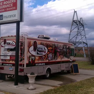 a food truck parked on the side of the road
