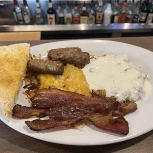 The all meat breakfast, with bacon, sausage, and country fried steak, hash browns and sourdough toast