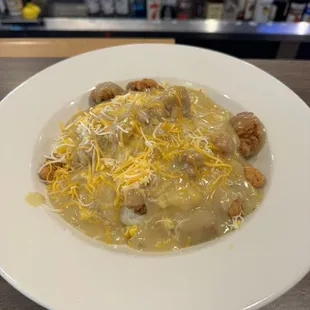 The Stoner bowl, With mashed potatoes gravy popcorn chicken and shredded cheese