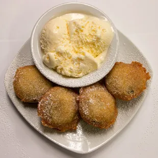 a bowl of ice cream and doughnuts