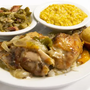 a plate of food with meat, rice, and beans