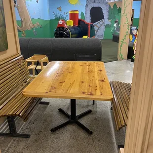 Table between kids play area and regular area