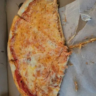 a half eaten pizza in a box