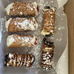 Traditional cannolis, espresso filling with chocolate chips, chocolate drizzle, caramel drizzle