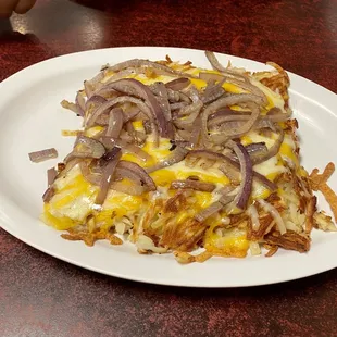 Hash browns with grilled onions and cheese
